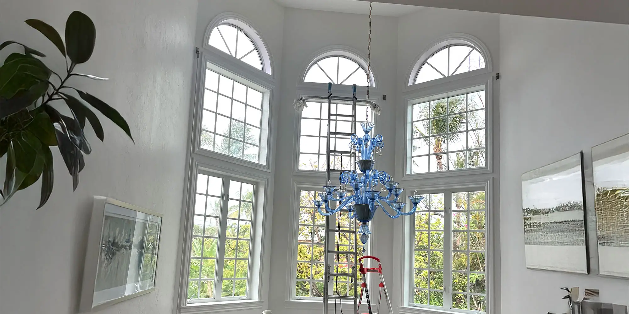Eco-Friendly-Window-Cleaning-Hero-Image Inside Room with tall windows being cleaned