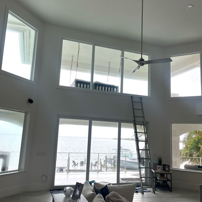 Eco-Friendly-Window-Cleaning Cleaning Windows in a high ceiling living room